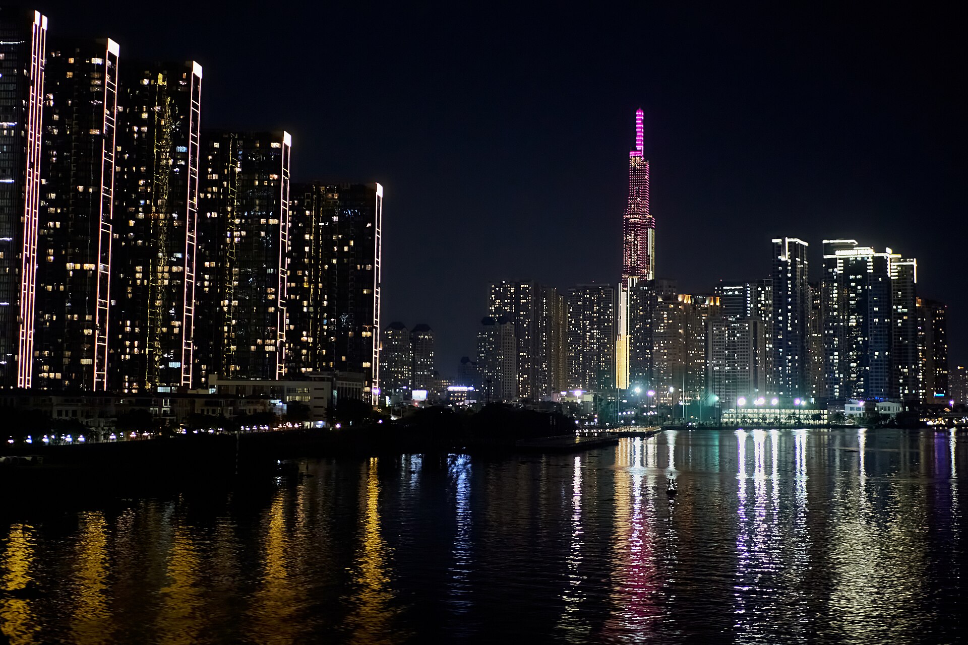 Landmark 81 and the Ho Chi Minh City skyline reflected in the Saigon River at night